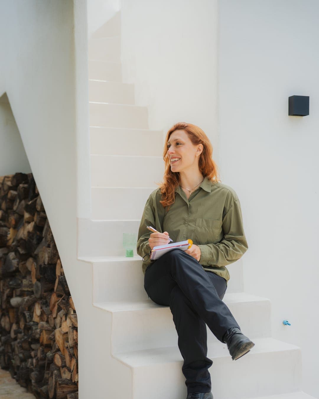 Chef Lara Petrella planning a menu in her notebook