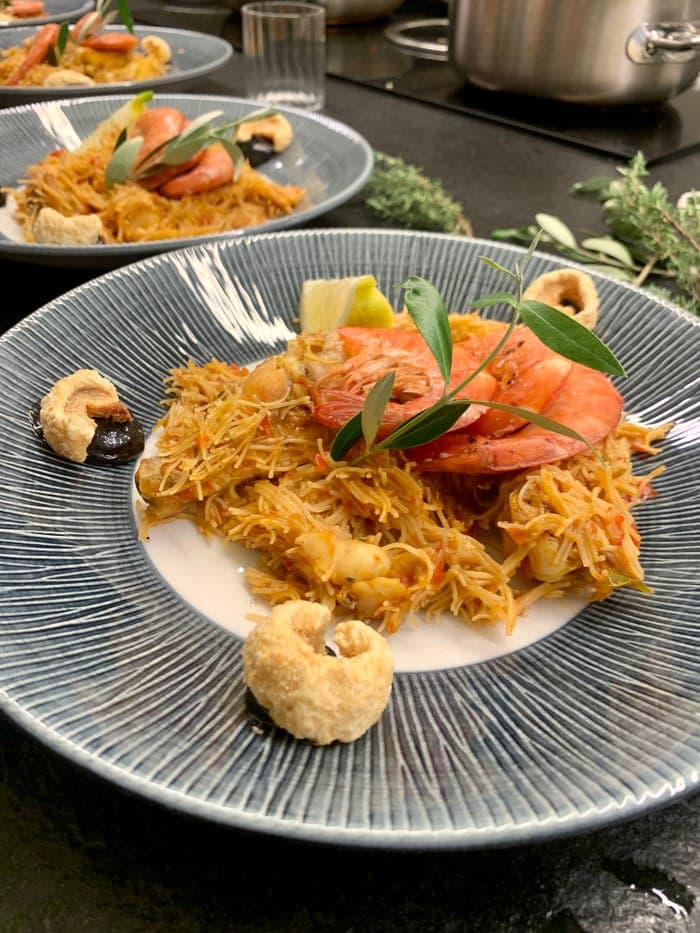Fideuà with king prawns, plated tableside